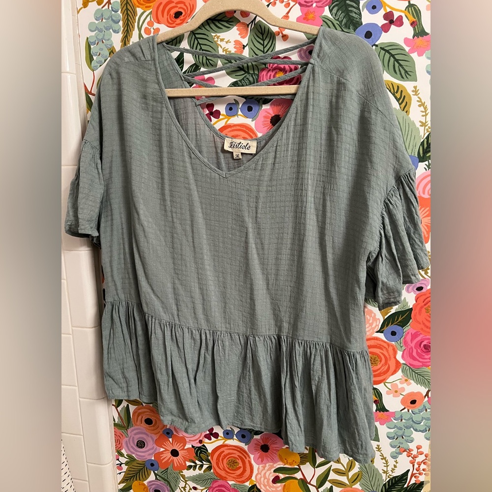 Flowy linen/gauzy top with flutter sleeves and strap details on back